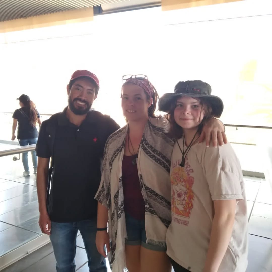 Andrés accompanying travelers during a cultural experience