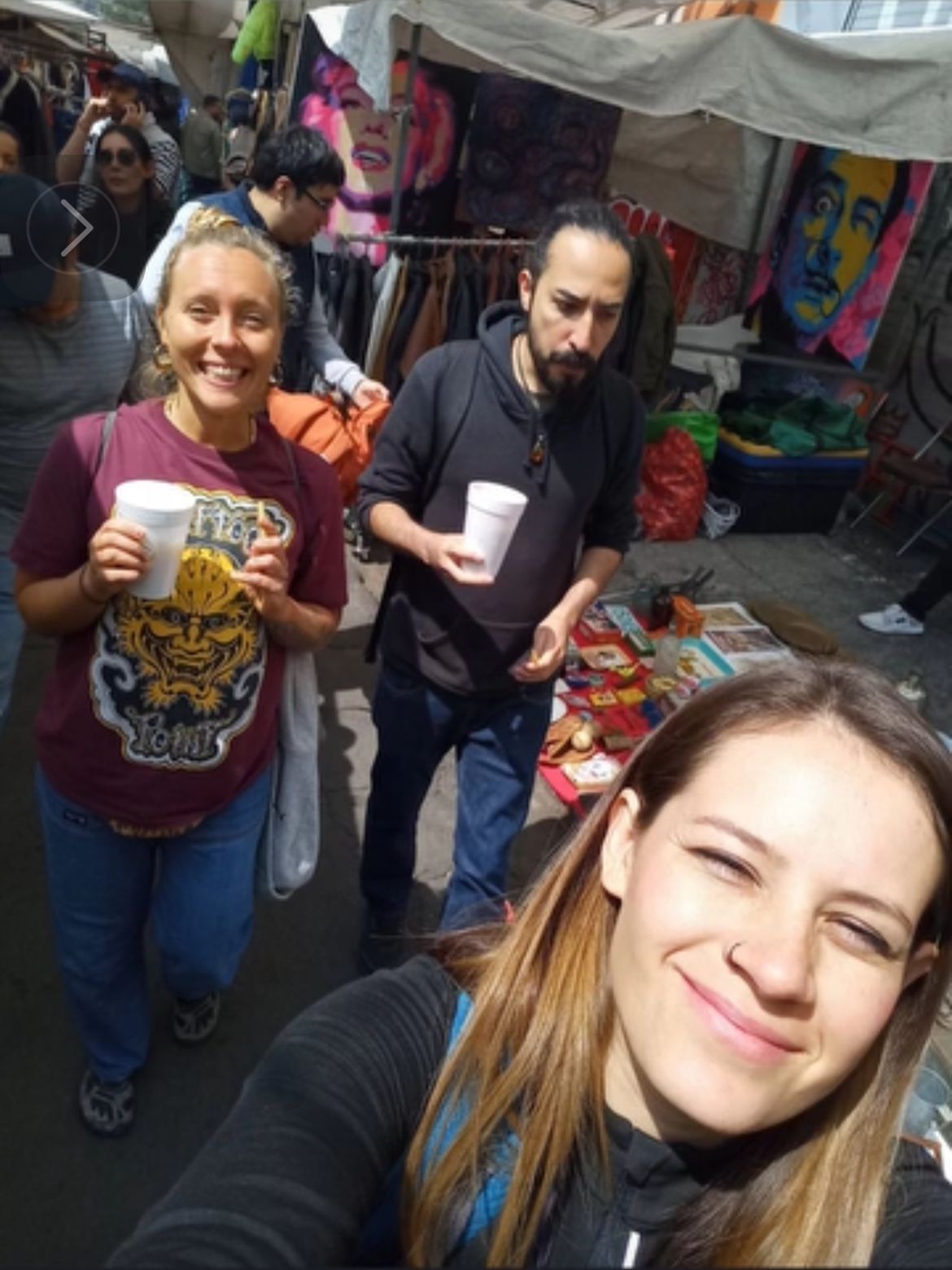 María accompanying a traveler through a Mexico City market