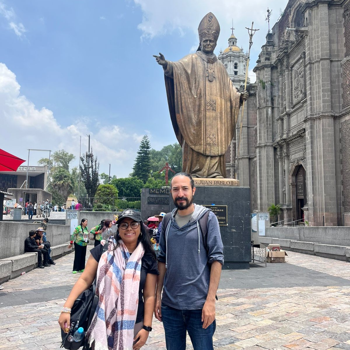 Carlos accompanying a traveler at the Basilica of Guadalupe